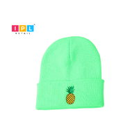 Bright Green Adult Beanie With a Pineapple Patch on it