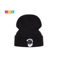 Adult Black Beanie With a Face Patch on It